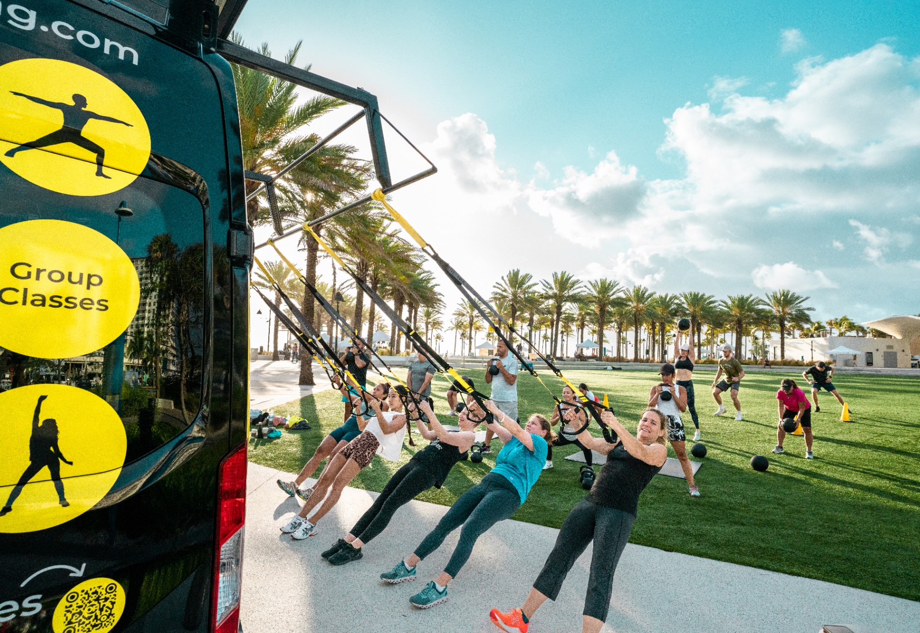 Outdoor TRX class at a Plantation park